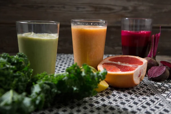 Glass of various juices and paste — Stock Photo, Image