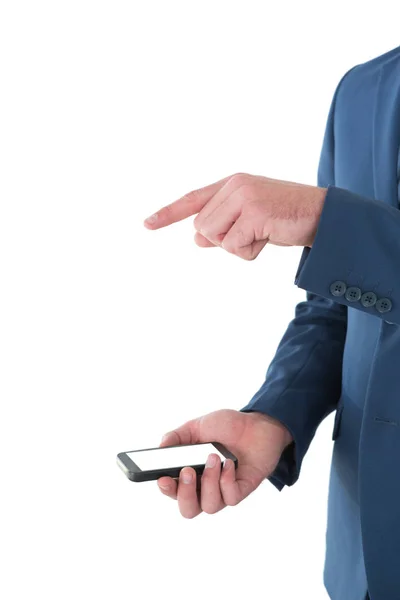 Businessman gesturing over mobile phone — Stock Photo, Image