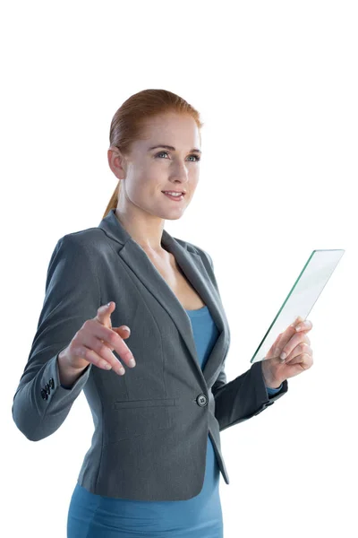 Businesswoman touching on imaginary screen — Stock Photo, Image