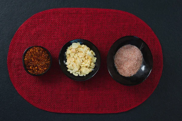 Red pepper flakes, roasted coconut chips — Stock Photo, Image