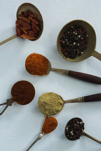 Various spices in wooden spoon — Stock Photo, Image
