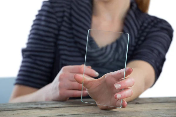 Businesswoman showing transparent glass interface — Stock Photo, Image