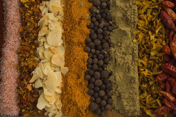 Various spices arranged in row — Stock Photo, Image