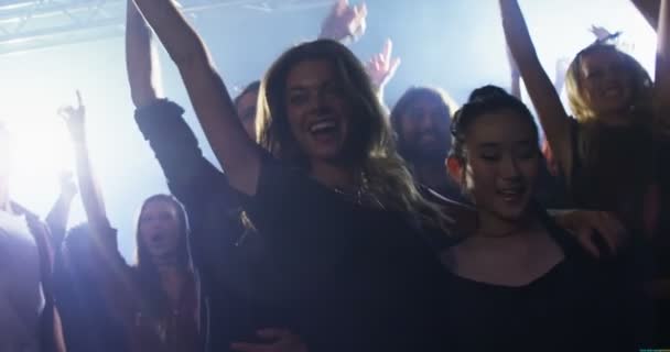 Group of people dancing at a concert — Stock Video