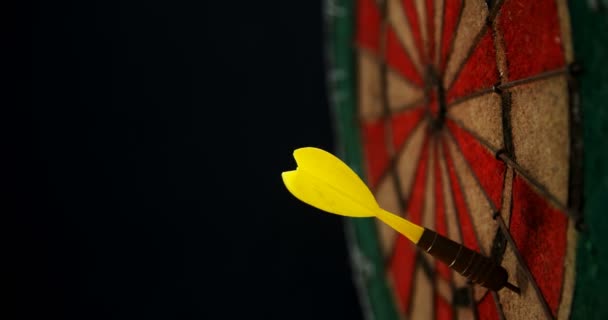 Arrow on dart against black background — Stock Video