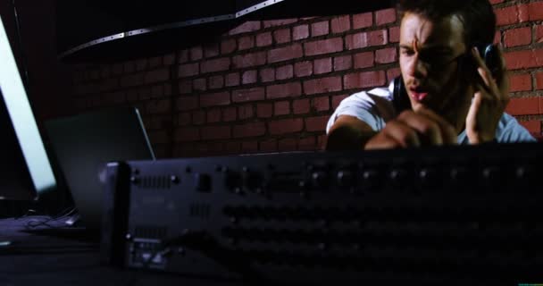 Dj man using sound mixer console at a concert — Stock Video