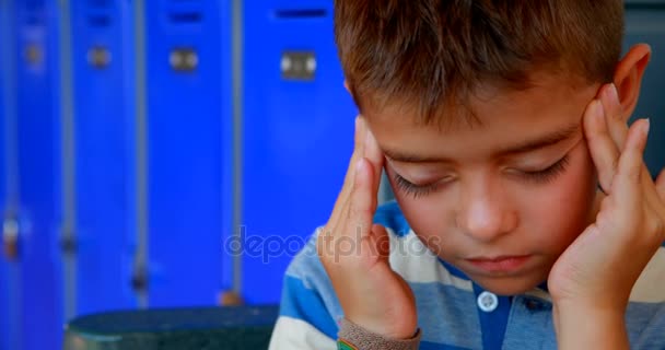 Schoolboy suffering from headache — Stock Video