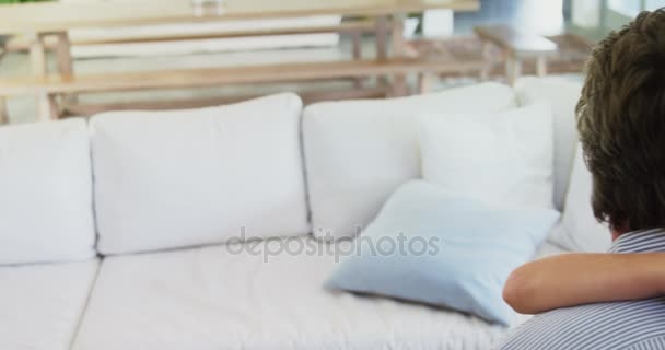 Father and son embracing each other in living room — Stock Video