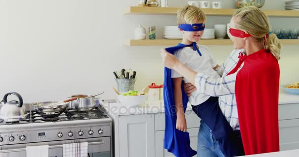 Mother and son pretending to be superhero — Stock Video