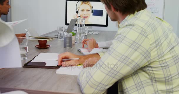 Business executives discussing while having video call on computer 4k — Stock Video