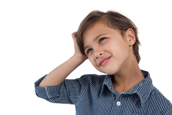 Boy standing against white background — Stock Photo, Image