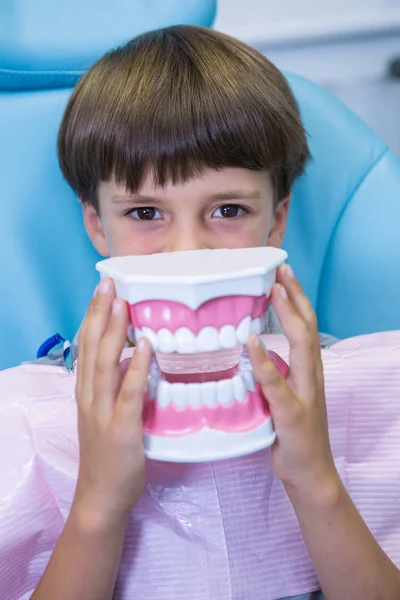 Boy covering face with dental mould — Stock Photo, Image