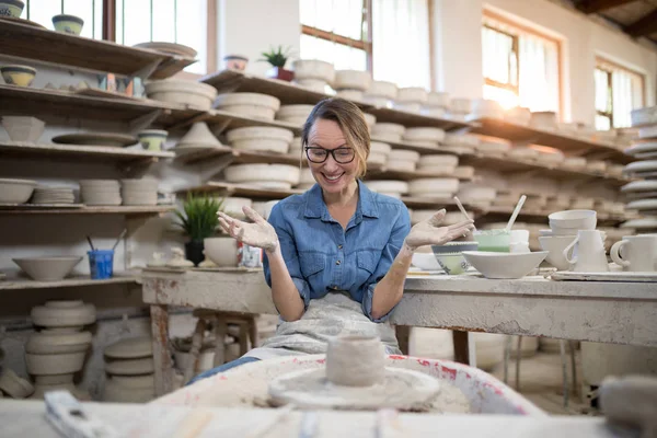 Excited female potter molding a clay — Stock Photo, Image