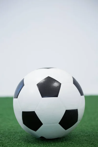 Football kept on artificial grass — Stock Photo, Image