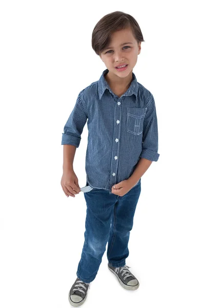 Boy standing with empty pockets — Stock Photo, Image