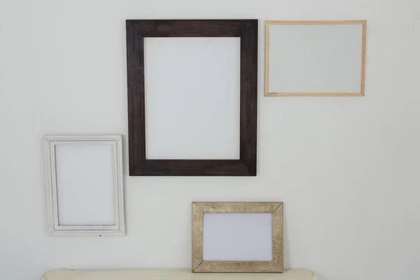 Frames hanging on wall — Stock Photo, Image
