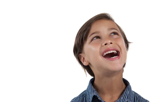 Boy standing against white background — Stock Photo, Image