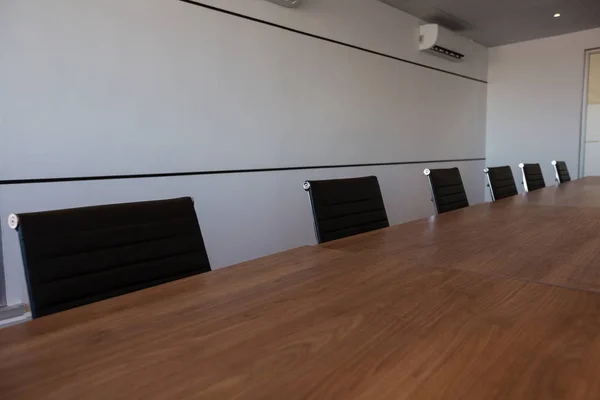 Empty office chairs at conference table — Stock Photo, Image