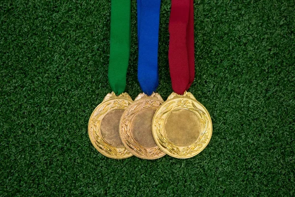 Medals on artificial grass — Stock Photo, Image