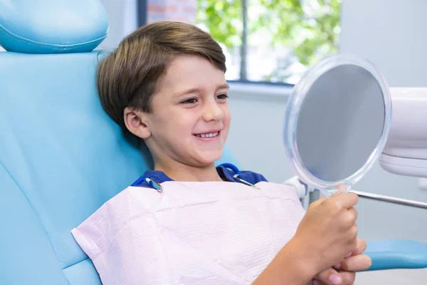 Cute boy looking at mirror — Stock Photo, Image