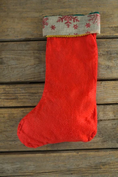Christmas stocking on wooden wall — Stock Photo, Image