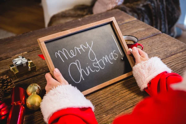 Santa claus drží břidlice — Stock fotografie