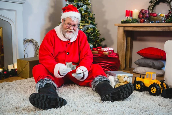 Santa Claus zittend op de vloer — Stockfoto