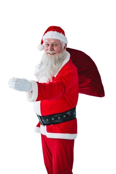 Santa Claus sosteniendo bolsa de Navidad — Foto de Stock