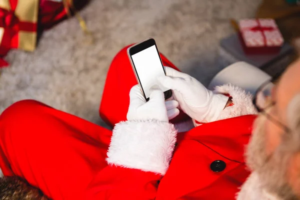 Santa claus using phone at home — Stock Photo, Image