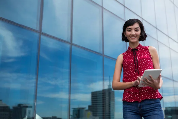 Female executive using digital tablet — Stock Photo, Image