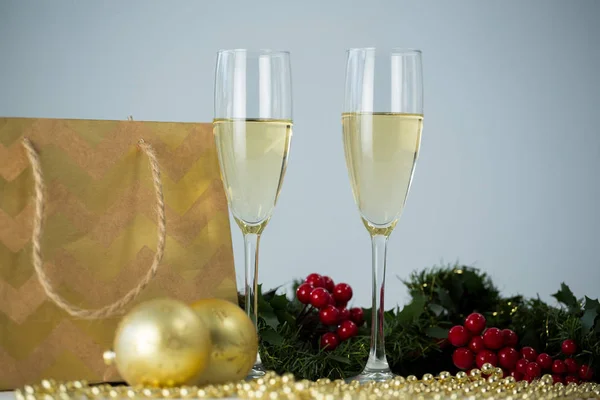 Champagne flute and christmas decoration — Stock Photo, Image