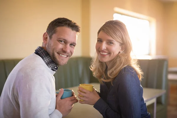 Couple having coffee in restaurant — Stock Photo, Image