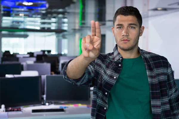 Male executive standing in office — Stock Photo, Image