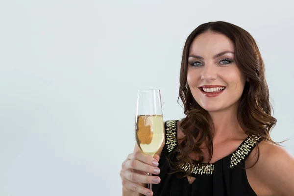 Woman holding glass of champagne — Stock Photo, Image