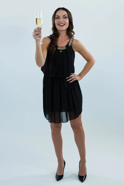 Smiling woman holding glass of champagne — Stock Photo, Image