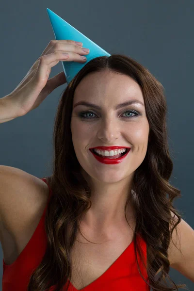 Woman wearing party hat — Stock Photo, Image