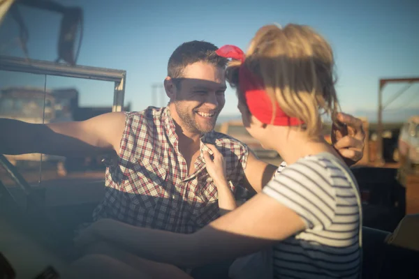 Couple interacting with each other in car — Stock Photo, Image