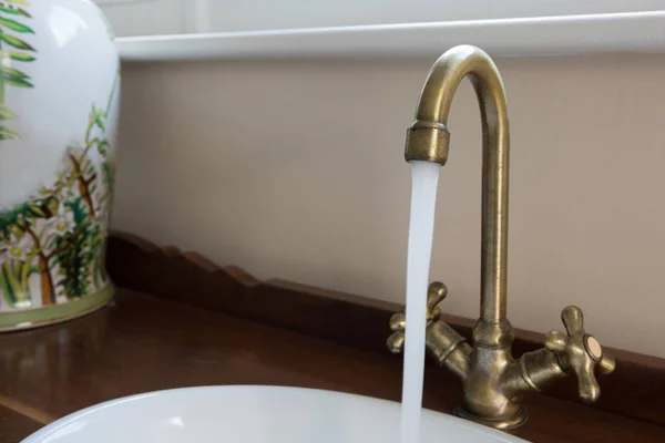 Water running through faucet — Stock Photo, Image