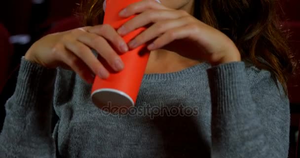 Woman watching movie in theater — Stock Video