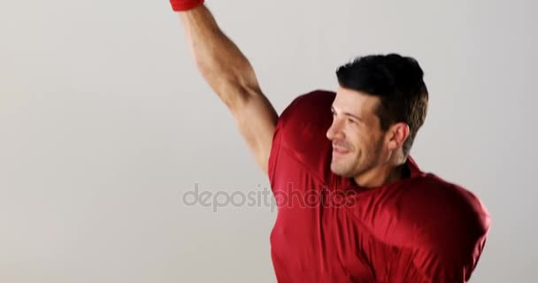 Football player holding helmet after victory — Stock Video