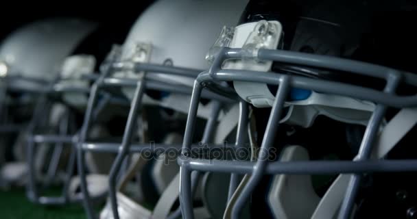 Head gears arranged on artificial turf — Stock Video