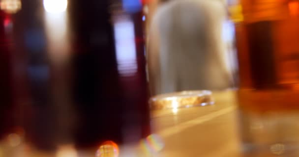 Three glass of whiskey on the bar counter — Stock Video