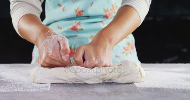 Woman kneading a dough — Stock Video