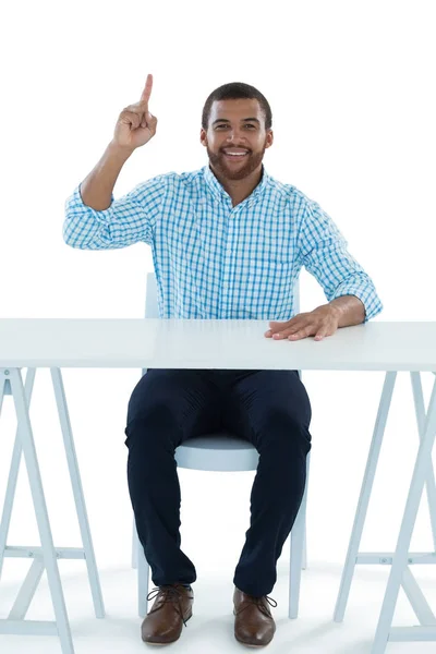 Male executive pointing upwards — Stock Photo, Image