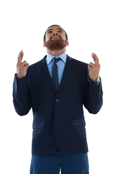 Affärsman som håller hans finger korsade — Stockfoto