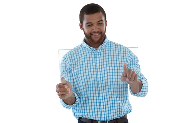 Male executive using glass digital tablet — Stock Photo, Image