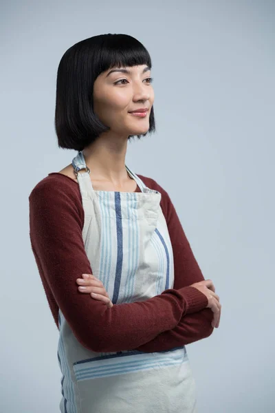 Waitress standing with arms crossed — Stock Photo, Image