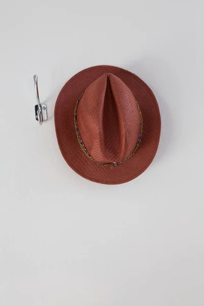 Hat hanging on hook — Stock Photo, Image