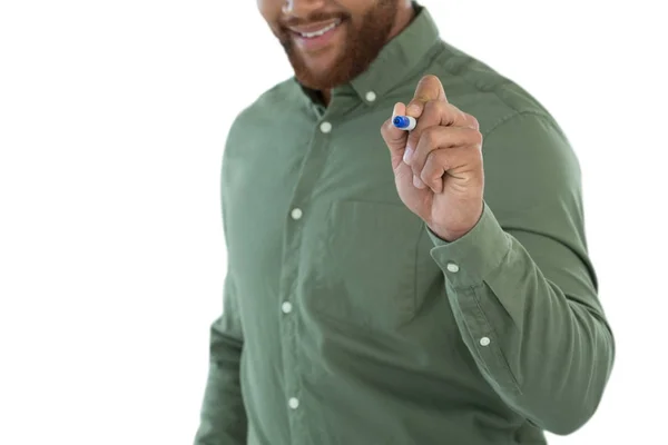 Male executive writing on invisible screen — Stock Photo, Image