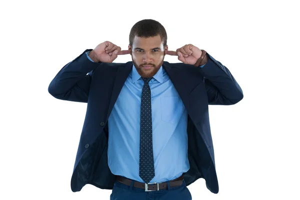 Businessman covering his ears — Stock Photo, Image